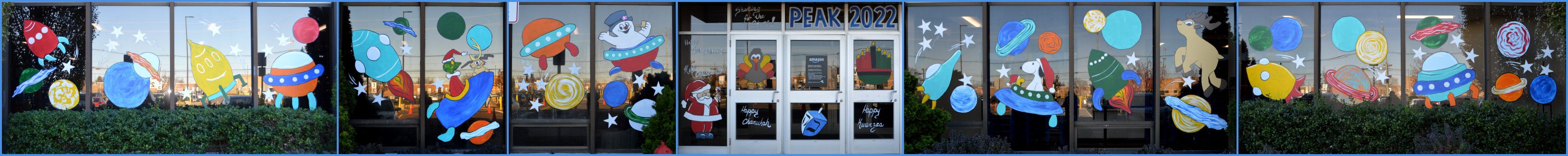 Peak and Holiday Window Paintings at the Amazon EWR5 Warehouse in Avenel, Middlesex County, NJ, featuring a Shooting for the Stars Theme, Thanksgiving, Christmas, Chanukah, and Kwanzaa