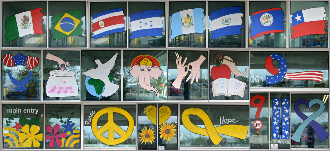 September Window Paintings at the CDW5 Amazon Sorting Center Warehouse in Carteret, Middlesex County, NJ, Featuring Independence Days for Mexico, Brazil, Costa Rica, Honduras, Guatemala, El Salvador, Belize, and Chile, Labor Day, US Air Force Day, International Day of Charity, International Day of Peace, Ganesh Chaturthi, Sign Languages of the World, Rosh Hashana and Yom Kippur, Patriot Day and 9/11 Remembrance Day, Hispanic Heritage Month, Childhood Cancer Awareness, and Suicide Prevention