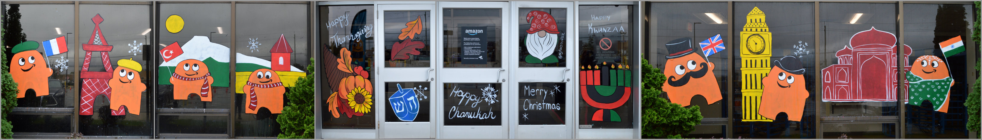 Fourth Quarter Window Paintings at Amazon Warehouse EWR5 in Avenel, Middlesex County, NJ, featuring the Peak Season Theme Winter Wonderland, Delivering Peak Around the World, and Thanksgiving, Chanukah, Christmas, and Kwanzaa