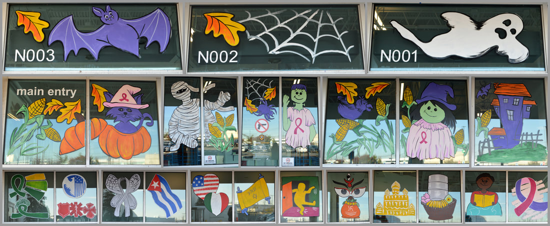 October Window Paintings at Amazon CDW5 Warehouse in Carteret, Middlesex County, NJ, featuring Halloween, Breast Cancer Awareness, World Mental Health Day, World Cerebral Palsy Day, Day of the Deployed, National First Responders Day, International Brain Tumor Awareness Week, Cuban Independence Day, Italian-American Heritage Month, Simchat Torah, National Coming Out Day, Mysore Dasara, Navratri, Pchum Ben, World Teachers' Day, and Domestic Violence Awareness