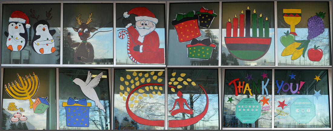December Window Painting at the Amazon CDW5 Sorting Center in Carteret, Middlesex County, NJ, featuring Christmas, Kwanzaa, Chanukah, Bodhi Day, and a Thank You to the Amazon Associates