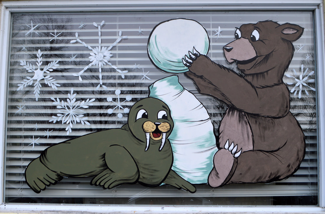 Winter Residential Window Painting featuring a bear and walrus building a snowman in Wayne, Passaic County, NJ