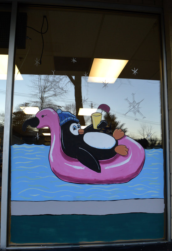 Lounging Penguin Winter Window Painting at Flamingo Pools in Stony Point, Rockland County, NY