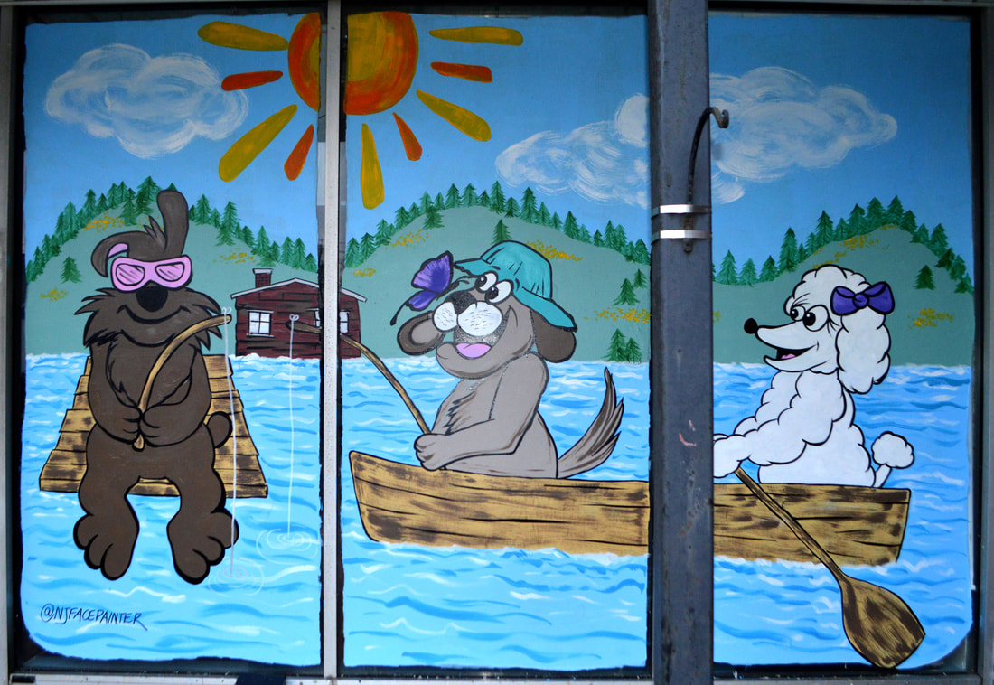 Spring Window Art at FurEver Friends Dog Grooming Salon in Bardonia, Rockland County, NY featuring dogs gone fishing