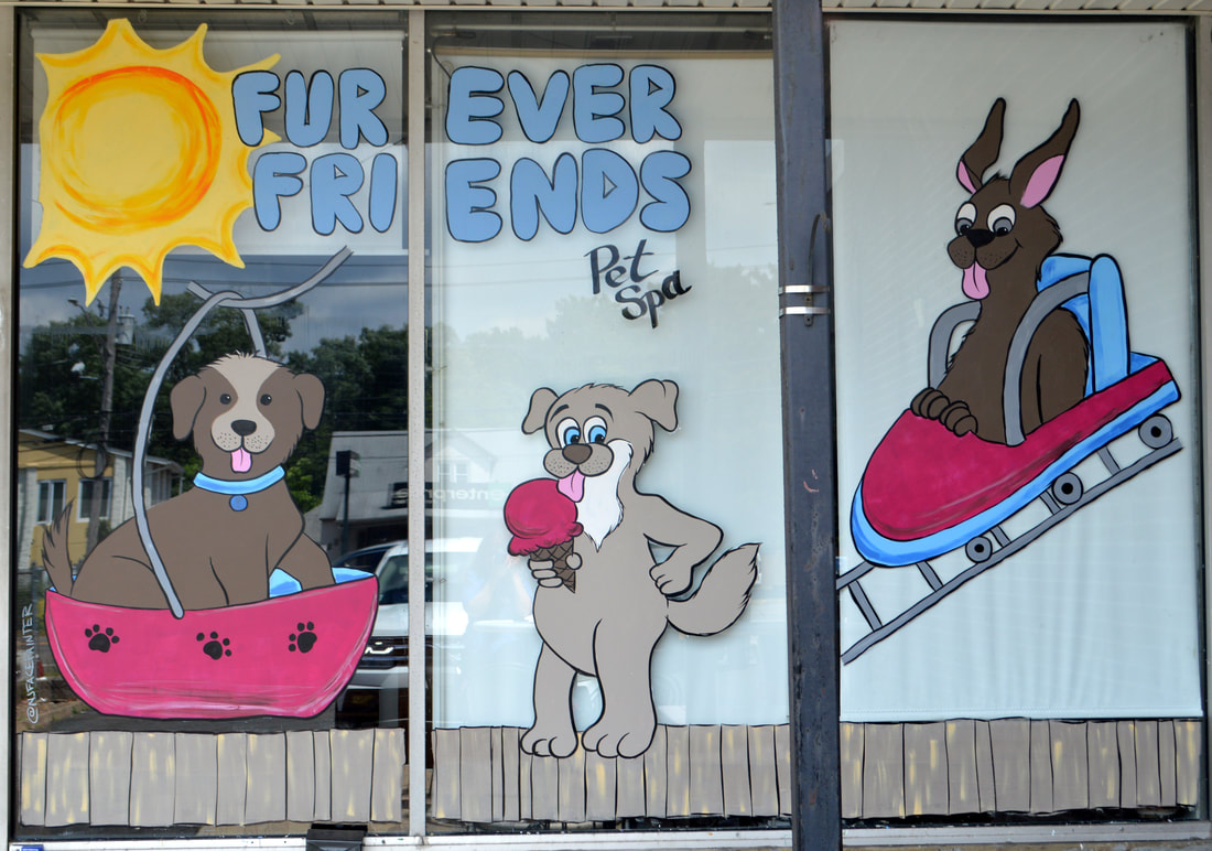 Summer Window Painting at FurEver Friends Pet Spa in Bardonia, Rockland County, NY featuring dogs at the boardwalk - on the ferris wheel, roller coaster, and eating ice cream