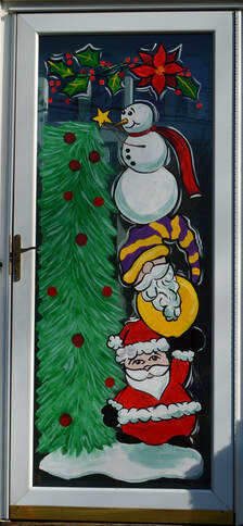 Residential Christmas Storm Door Painting in Franklin Lakes, Bergen County, NJ featuring Santa, a gnome, and a snowman decorating a tree